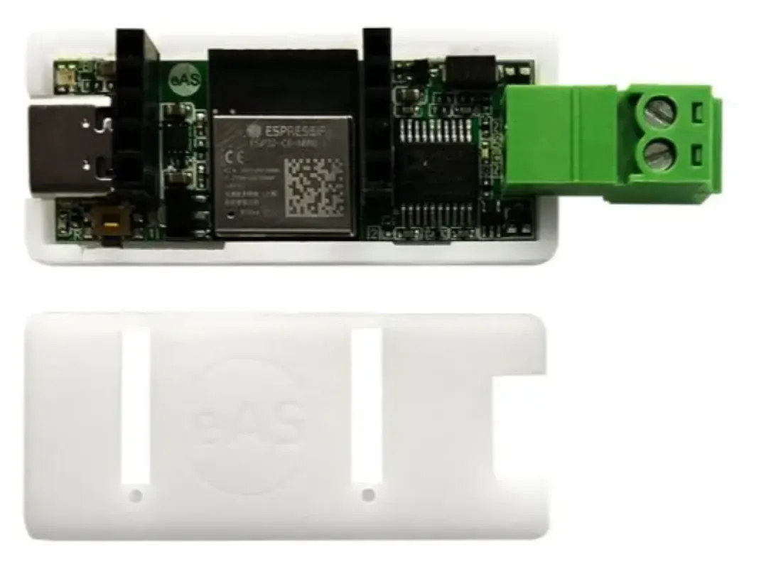 The eBUS Adapter Shield: an ESP32-C6 board with a green two-pole screw terminal, above its 3D printed case