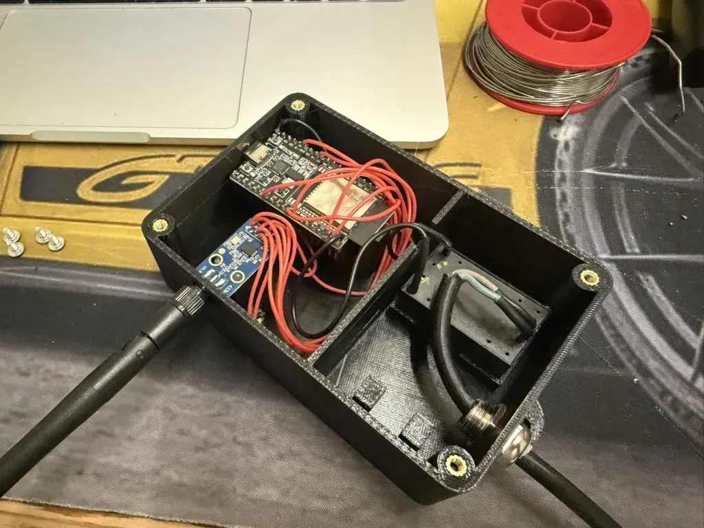 Everything installed: the Hi-Link on the right, the ESP32 and CC1101 on the left, the antenna screwed on through the back wall