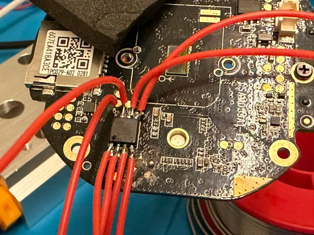 Flying leads soldered straight onto the eight legs of the flash chip