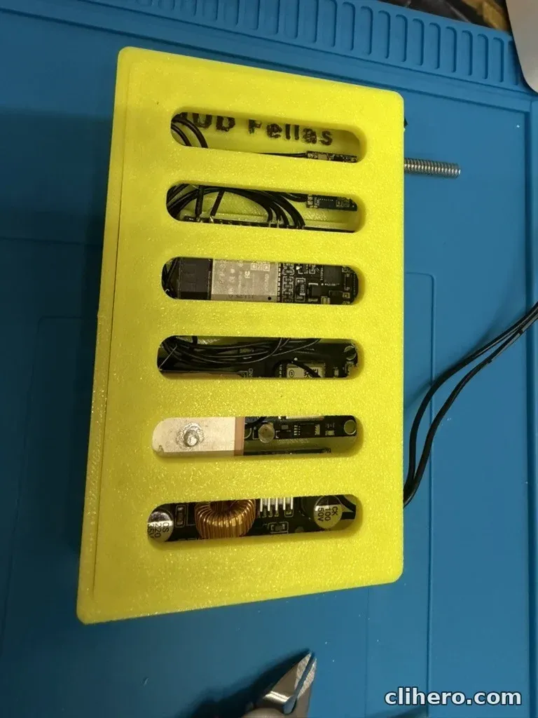The closed case from above, each board visible through one of the six lid slots