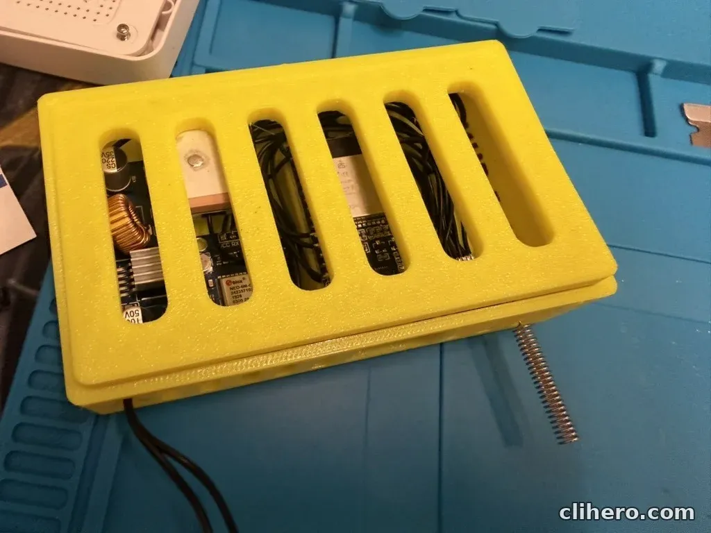A closer look through the lid at the NEO-6M GPS module and the buck converter's coil and heatsink