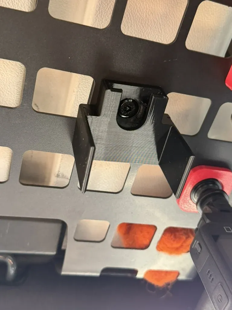 The empty clip on the panel, held by its single bolt