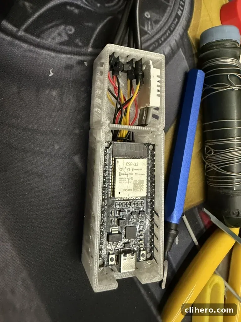 The ESP32 in its half of the case, wiring compartment behind it